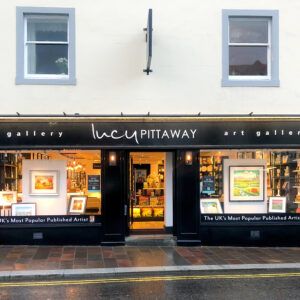 Front view of the Lucy Pittaway Art Gallery in Keswick, with framed artwork and homeware displayed in the windows.