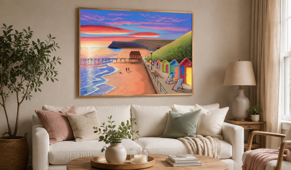 Yorkshire Prints seaside artwork displayed above a cosy living room sofa